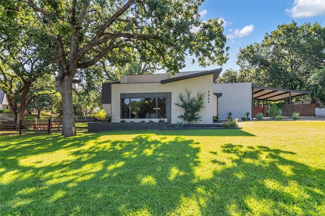 3449 W T Parr Rd W, Grapevine, TX 76051 - back of house with stucco siding and a carport