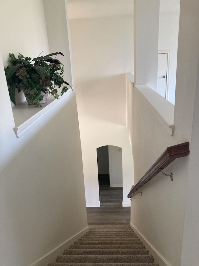 2601 Pinto Dr, Denton, TX 76210 - stairway featuring wood finished floors and arched walkways
