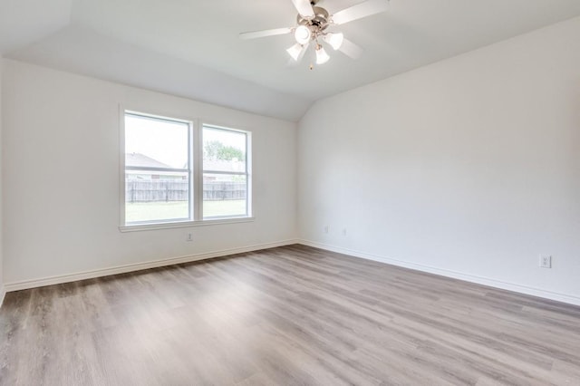 2601 Pinto Dr, Denton, TX 76210 - unfurnished room featuring wood finished floors, vaulted ceiling, and ceiling fan