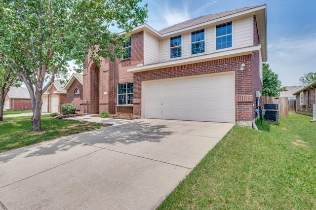 2601 Pinto Dr, Denton, TX 76210 - traditional-style house with brick siding, concrete driveway, and an attached garage
