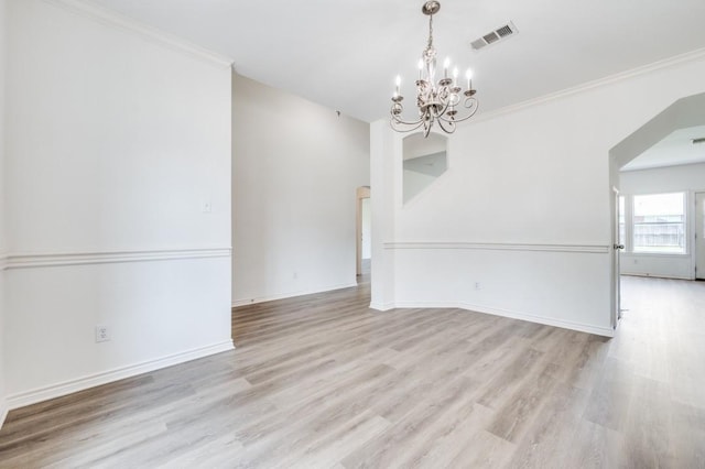 2601 Pinto Dr, Denton, TX 76210 - empty room with a chandelier, light wood-type flooring, and ornamental molding