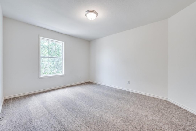 2601 Pinto Dr, Denton, TX 76210 - unfurnished room with carpet floors and baseboards