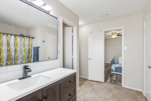 2124 Franks St, Fort Worth, TX 76177 - full bath with vanity, a ceiling fan, backsplash, connected bathroom, and a shower with shower curtain