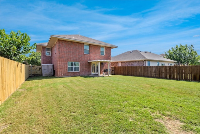 2124 Franks St, Fort Worth, TX 76177 - back of house with brick siding and a fenced backyard
