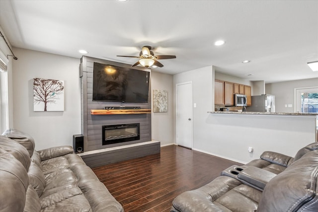 2124 Franks St, Fort Worth, TX 76177 - living room with dark wood-type flooring, a large fireplace, a ceiling fan, and recessed lighting
