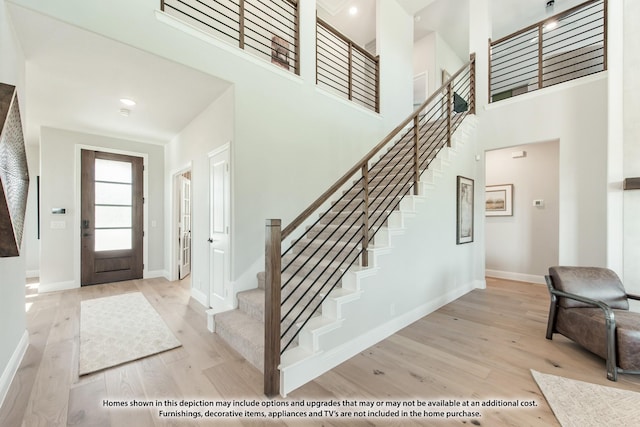 2301 Christopher Rd, Mansfield, TX 76063 - foyer entrance with stairs, wood finished floors, and a towering ceiling