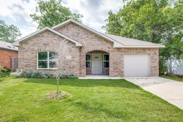 2726 Lawrence St, Dallas, TX 75215 - view of front of property with brick siding, an attached garage, concrete driveway, and a front yard