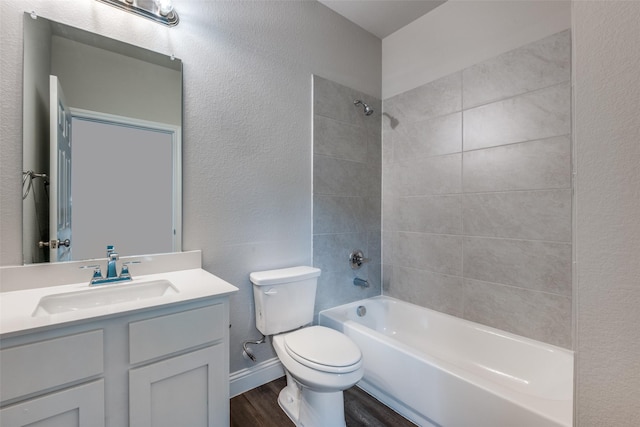 2726 Lawrence St, Dallas, TX 75215 - bathroom with wood finished floors, bathing tub / shower combination, vanity, and a textured wall