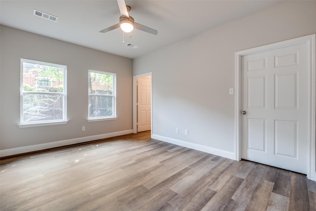 2726 Lawrence St, Dallas, TX 75215 - unfurnished bedroom featuring light wood-style floors and a ceiling fan