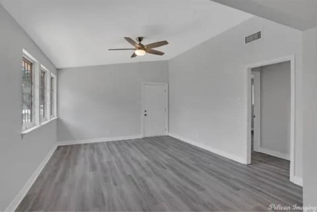 635 Browning St, Shreveport, LA 71106 - spare room with vaulted ceiling, ceiling fan, and wood finished floors