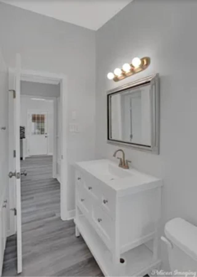 635 Browning St, Shreveport, LA 71106 - bathroom with vanity and wood finished floors