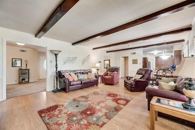 1719 W Day St, Denison, TX 75020 - living room with beam ceiling and wood finished floors