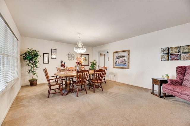 1719 W Day St, Denison, TX 75020 - dining space featuring light colored carpet and a chandelier