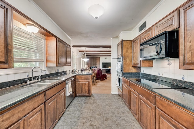 1719 W Day St, Denison, TX 75020 - kitchen with black appliances, backsplash, brown cabinetry, stone finish flooring, and dark stone countertops