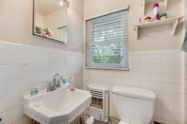 1719 W Day St, Denison, TX 75020 - half bath with tile walls and a wainscoted wall