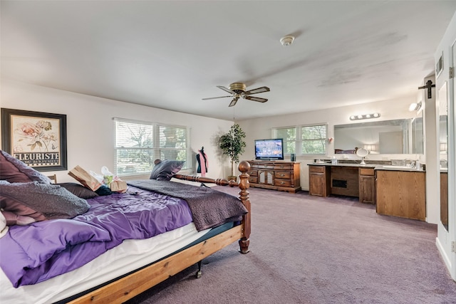 1719 W Day St, Denison, TX 75020 - bedroom with light colored carpet and a ceiling fan
