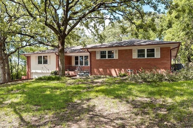 1719 W Day St, Denison, TX 75020 - view of front of house with brick siding, an attached garage, a front yard, and covered porch
