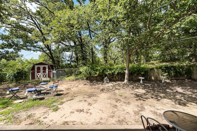 1719 W Day St, Denison, TX 75020 - view of yard with a storage unit and view of scattered trees