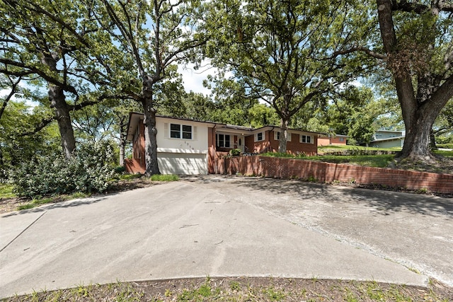 1719 W Day St, Denison, TX 75020 - view of front facade with concrete driveway, stucco siding, and a garage