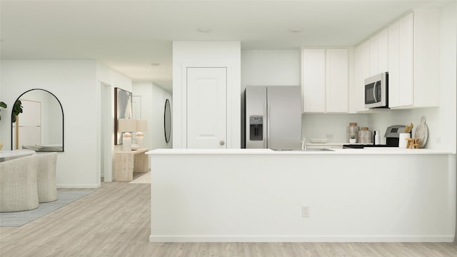 4949 Arden Springs Ave, Fort Worth, TX 76179 - kitchen featuring refrigerator with ice dispenser, stainless steel microwave, range, light wood-style flooring, and white cabinets