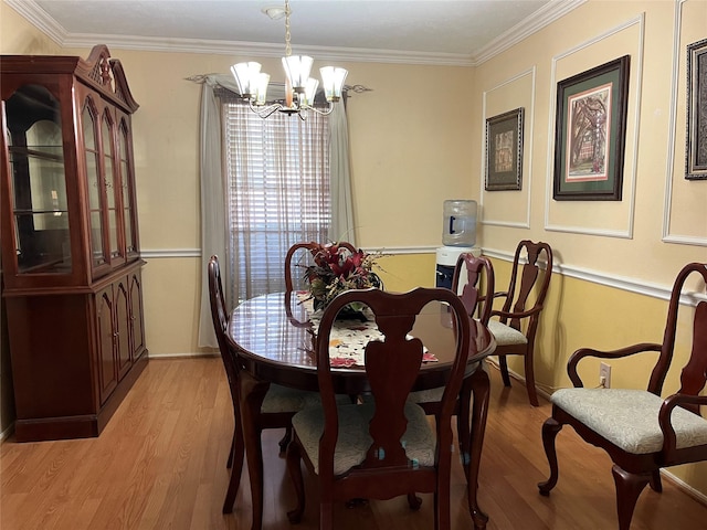 5505 Miami Dr, Rowlett, TX 75088 - dining space featuring a chandelier, light wood-type flooring, and crown molding