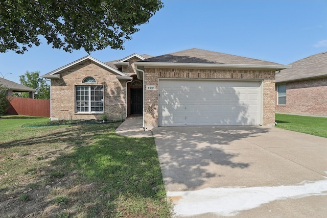 5901 Ozark Dr, Fort Worth, TX 76131 - ranch-style home featuring an attached garage, brick siding, and concrete driveway
