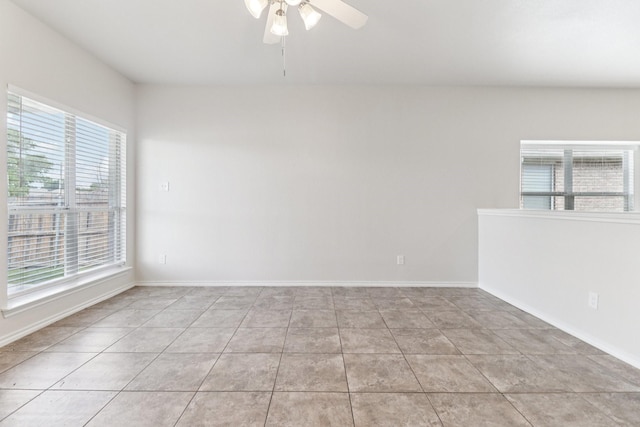 5901 Ozark Dr, Fort Worth, TX 76131 - empty room featuring healthy amount of natural light, a ceiling fan, and light tile patterned floors