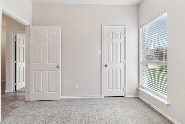 5901 Ozark Dr, Fort Worth, TX 76131 - unfurnished bedroom featuring multiple windows
