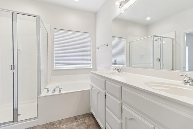 5901 Ozark Dr, Fort Worth, TX 76131 - full bathroom with a shower stall, double vanity, a garden tub, and tile patterned floors