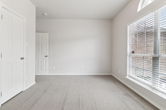 5901 Ozark Dr, Fort Worth, TX 76131 - unfurnished bedroom with multiple windows and carpet