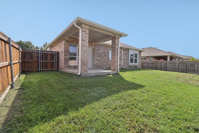 5901 Ozark Dr, Fort Worth, TX 76131 - back of property with a patio, a fenced backyard, and brick siding