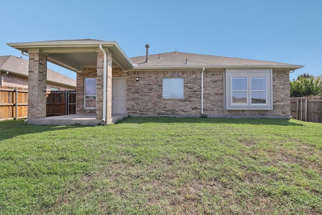 5901 Ozark Dr, Fort Worth, TX 76131 - back of house with a fenced backyard, a patio area, and brick siding