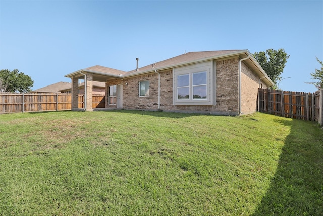 5901 Ozark Dr, Fort Worth, TX 76131 - back of house featuring a fenced backyard and brick siding