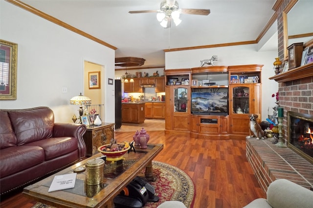 2031 Deepwood St, Mesquite, TX 75181 - living area with crown molding, a ceiling fan, light wood-style flooring, and a fireplace