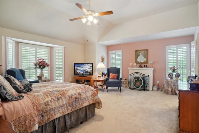 2031 Deepwood St, Mesquite, TX 75181 - bedroom with carpet flooring, vaulted ceiling, a fireplace, and ceiling fan