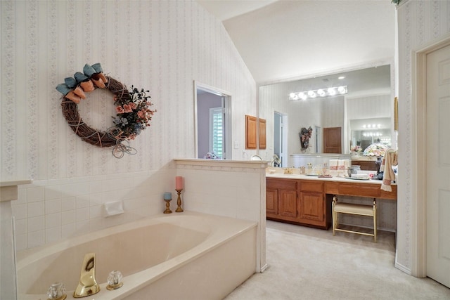 2031 Deepwood St, Mesquite, TX 75181 - full bathroom with wallpapered walls, a bath, vanity, and vaulted ceiling