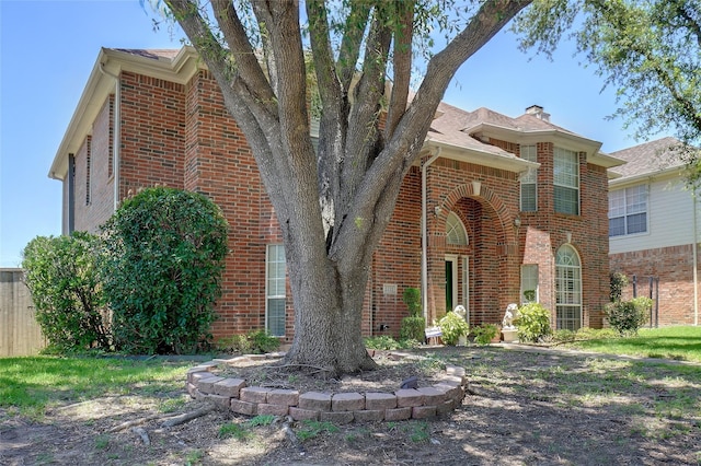 2031 Deepwood St, Mesquite, TX 75181 - view of front facade with brick siding and a chimney