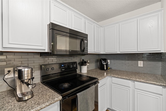 602 Hermosillo Plz, Dallas, TX 75211 - kitchen with black appliances, white cabinets, a textured ceiling, backsplash, and light stone countertops