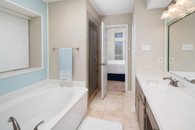 5723 Sachse St, Sachse, TX 75048 - bathroom with vanity, a garden tub, and a shower stall