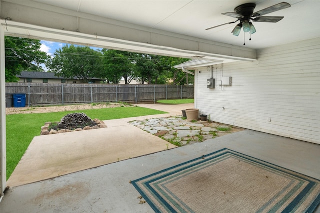 5723 Sachse St, Sachse, TX 75048 - fenced backyard with a ceiling fan and a patio area