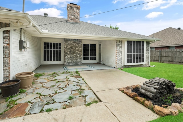 5723 Sachse St, Sachse, TX 75048 - back of property with a patio, a chimney, brick siding, and a shingled roof