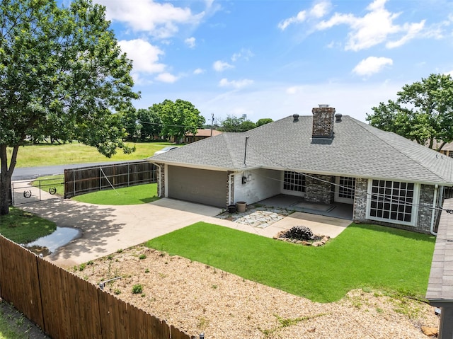 5723 Sachse St, Sachse, TX 75048 - back of house featuring a fenced backyard, roof with shingles, driveway, an attached garage, and a chimney