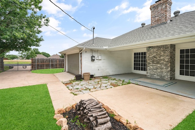 5723 Sachse St, Sachse, TX 75048 - view of patio featuring an attached garage