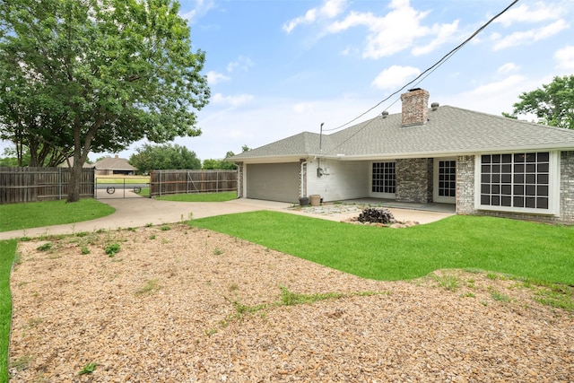 5723 Sachse St, Sachse, TX 75048 - back of property with driveway, roof with shingles, a garage, and a chimney