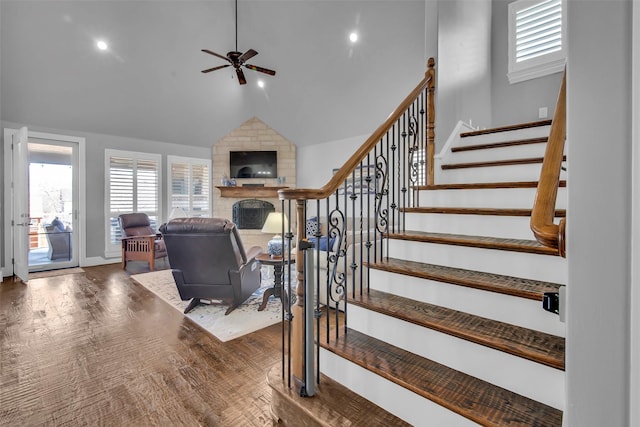 2911 Butterfield Trl, Sherman, TX 75092 - stairway featuring a ceiling fan, a large fireplace, vaulted ceiling, healthy amount of natural light, and wood finished floors
