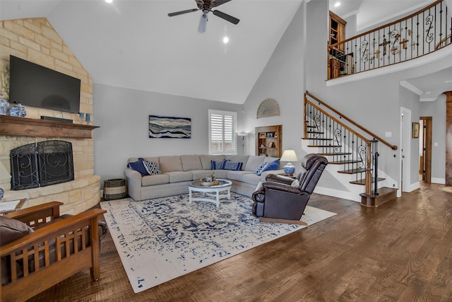 2911 Butterfield Trl, Sherman, TX 75092 - living room with high vaulted ceiling, ceiling fan, a fireplace, stairs, and wood finished floors