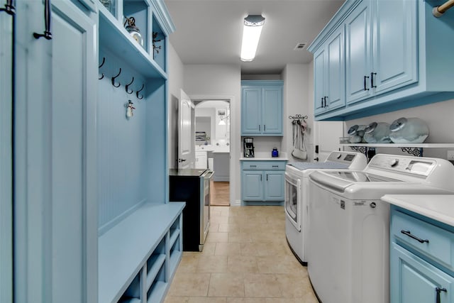 2911 Butterfield Trl, Sherman, TX 75092 - laundry room with independent washer and dryer, cabinet space, and light tile patterned floors