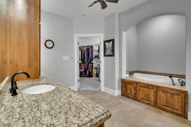 2911 Butterfield Trl, Sherman, TX 75092 - full bath with ceiling fan, a bath, vanity, and a spacious closet