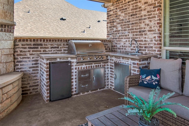 2911 Butterfield Trl, Sherman, TX 75092 - view of patio / terrace featuring a sink and an outdoor kitchen