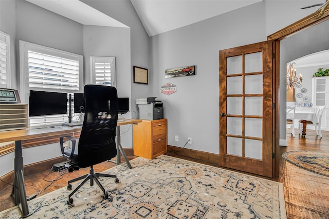 2911 Butterfield Trl, Sherman, TX 75092 - office with vaulted ceiling, wood finished floors, arched walkways, and a chandelier